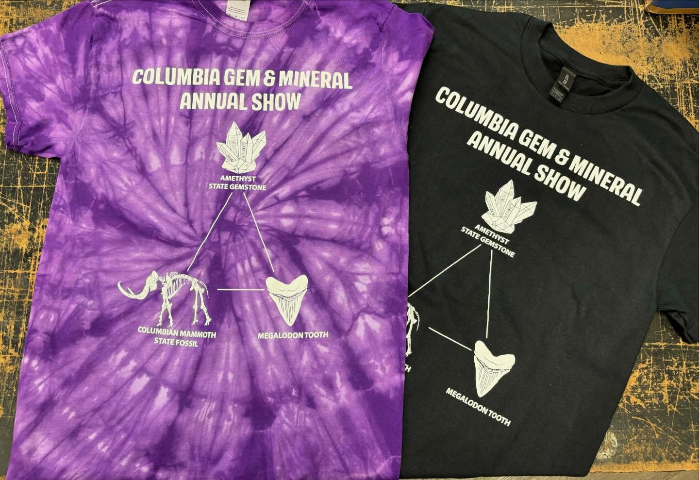 Purple tie-dye and black T-shirts with Columbia Gem & Mineral Annual Show print.