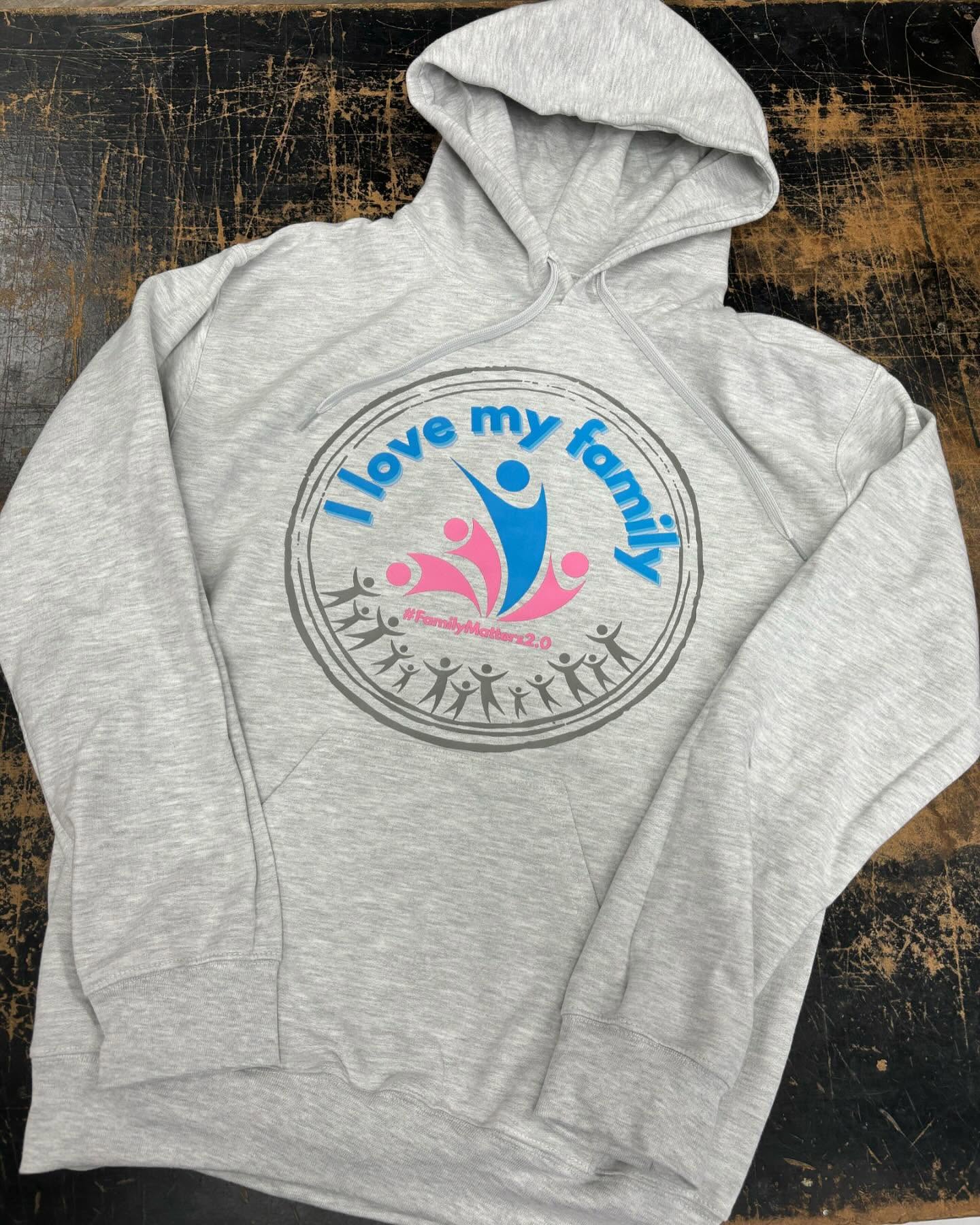 Light gray hoodie with a blue and pink "I Love My Family" graphic.