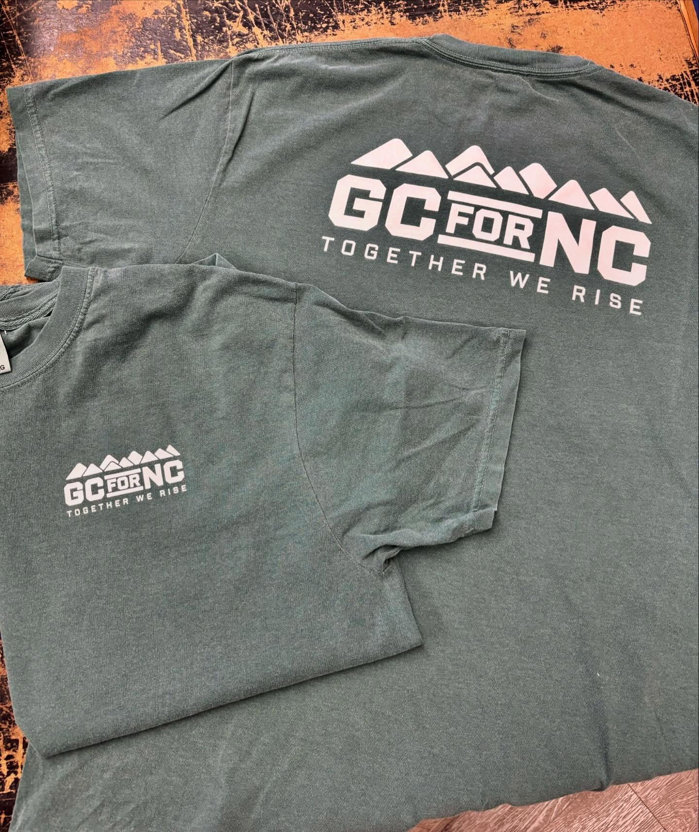 T-shirts with "GC for NC Together We Rise" mountain-themed logo.