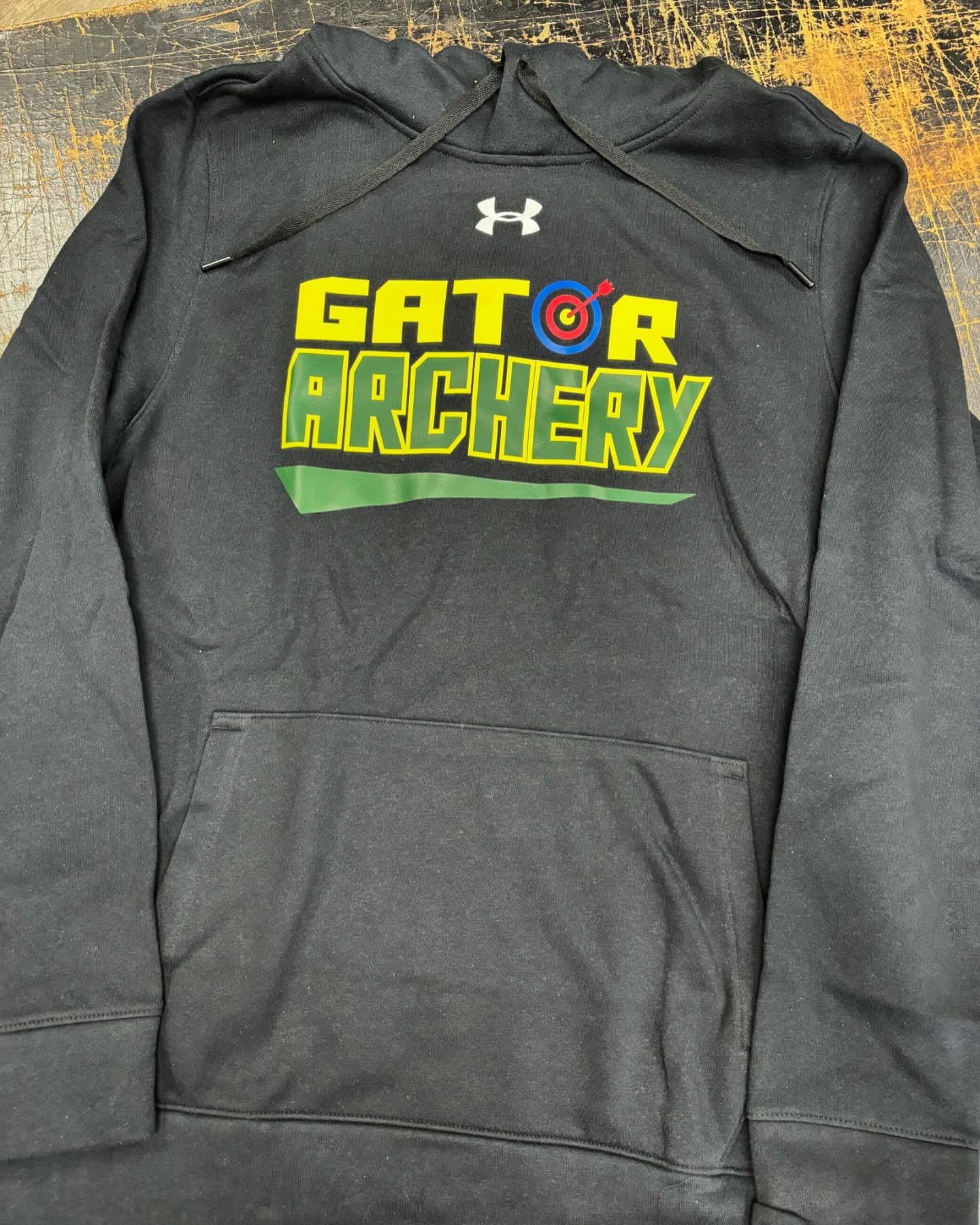 Black Under Armour hoodie with a bold "Gator Archery" logo in yellow and green.